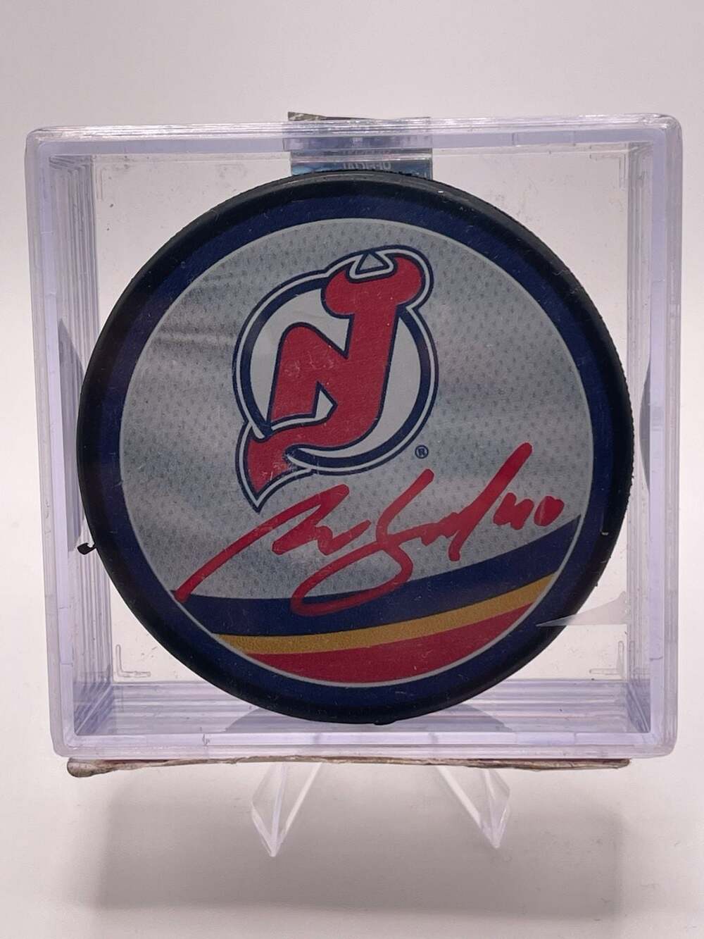 Akira Schmid Autographed New Jersey Devils Reverse Retro Hockey Puck
